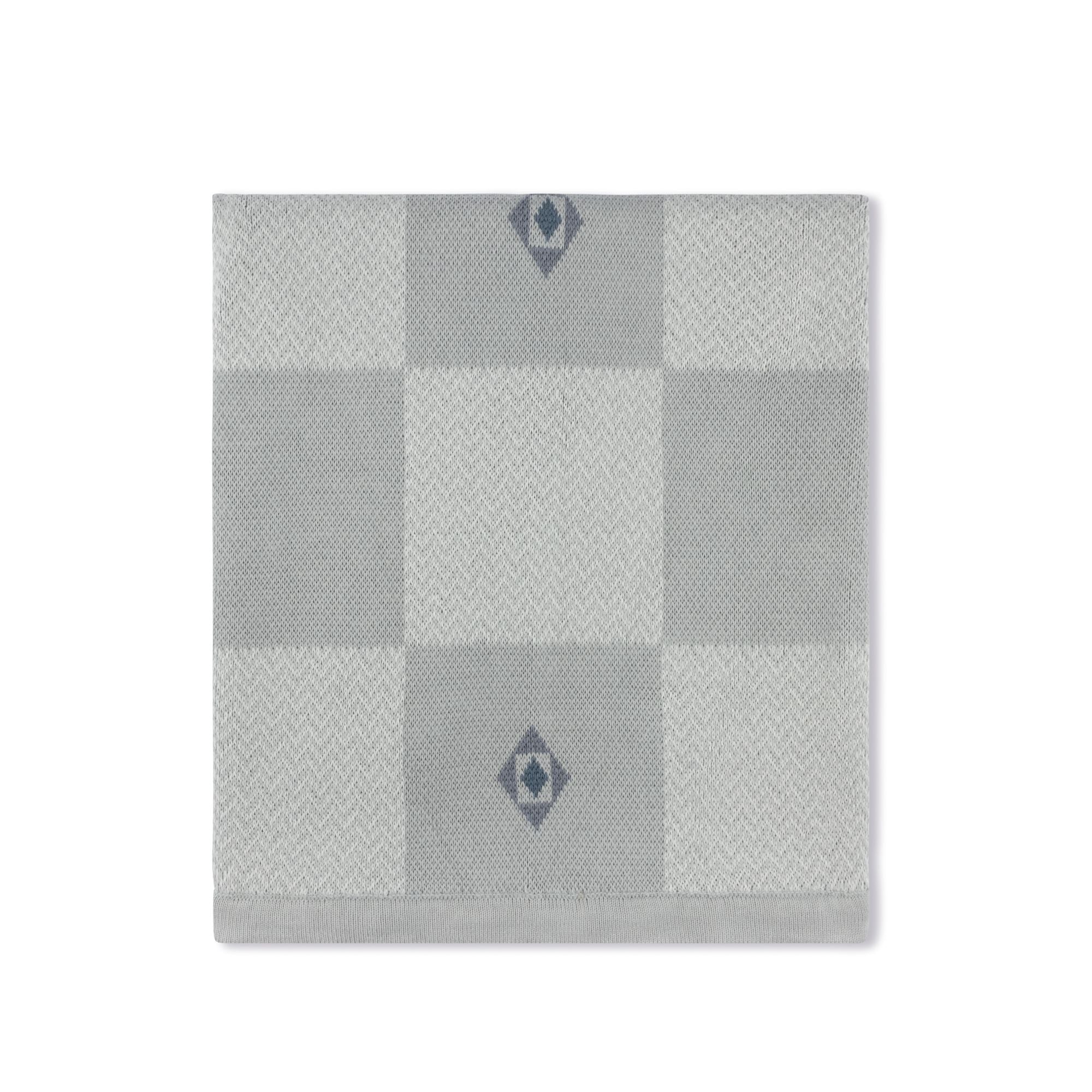 Jacquard knit baby blanket in blue by Tricot Bebe